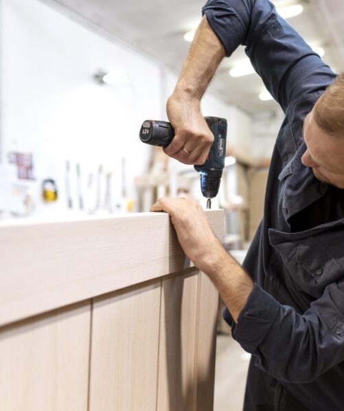 hardworking man doing his job woodshop scaled e1727585993398